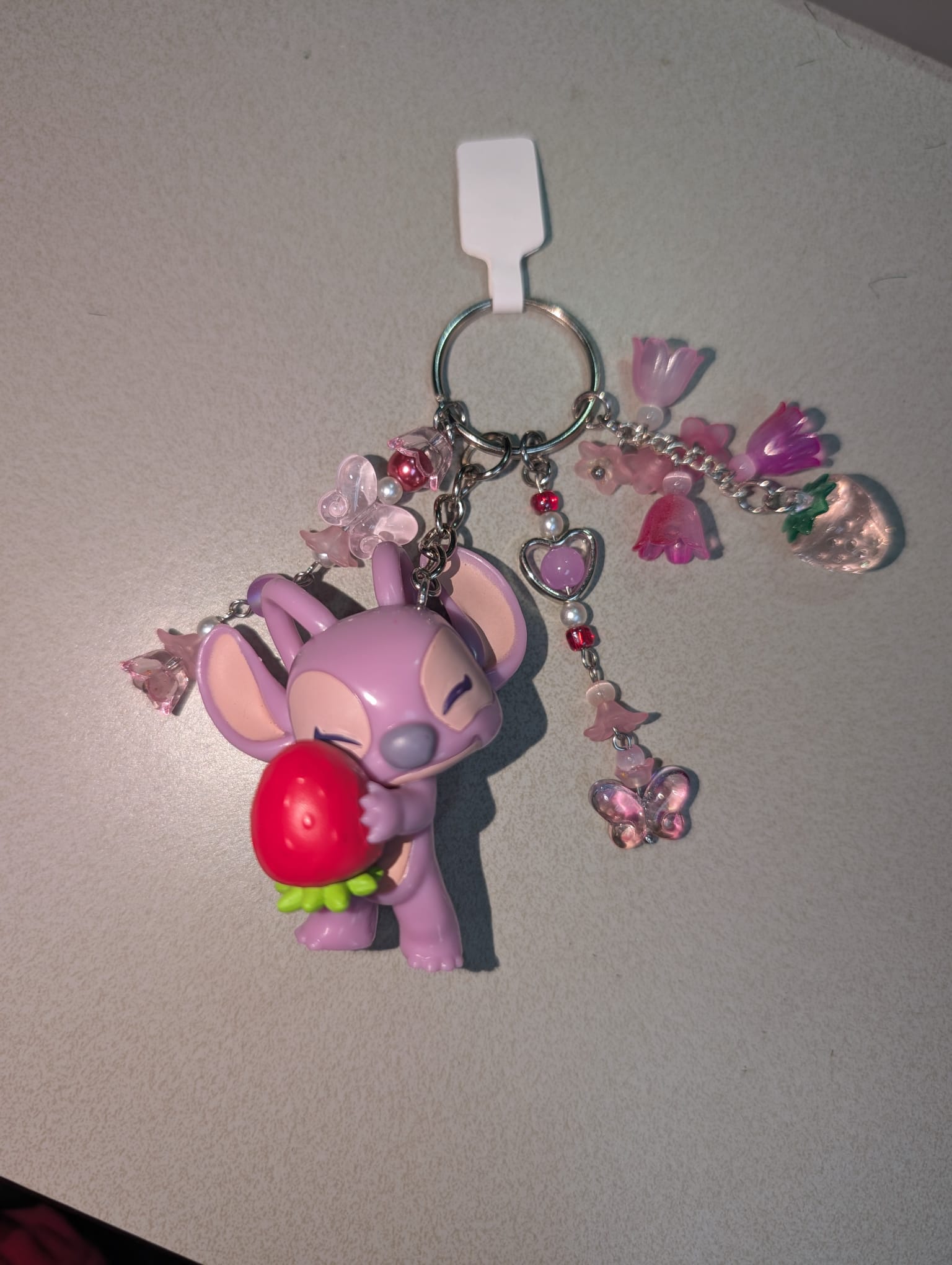 Angel Holding a Strawberry Bag Charm